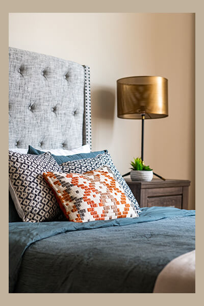 Colorful throw accent pillows on a bed