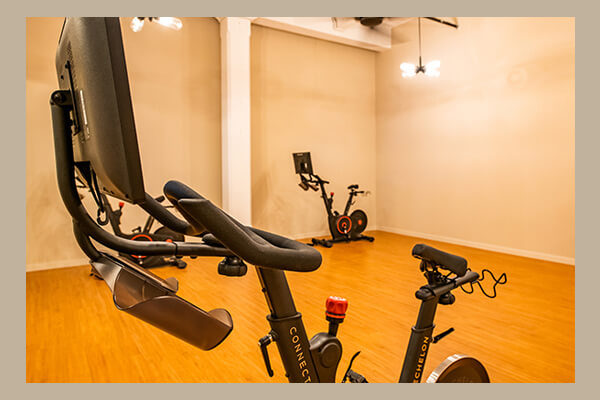 Exercise room with stationary bikes
