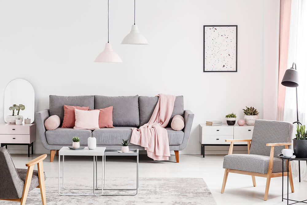 Cute, feminine living room space in modern loft apartment
