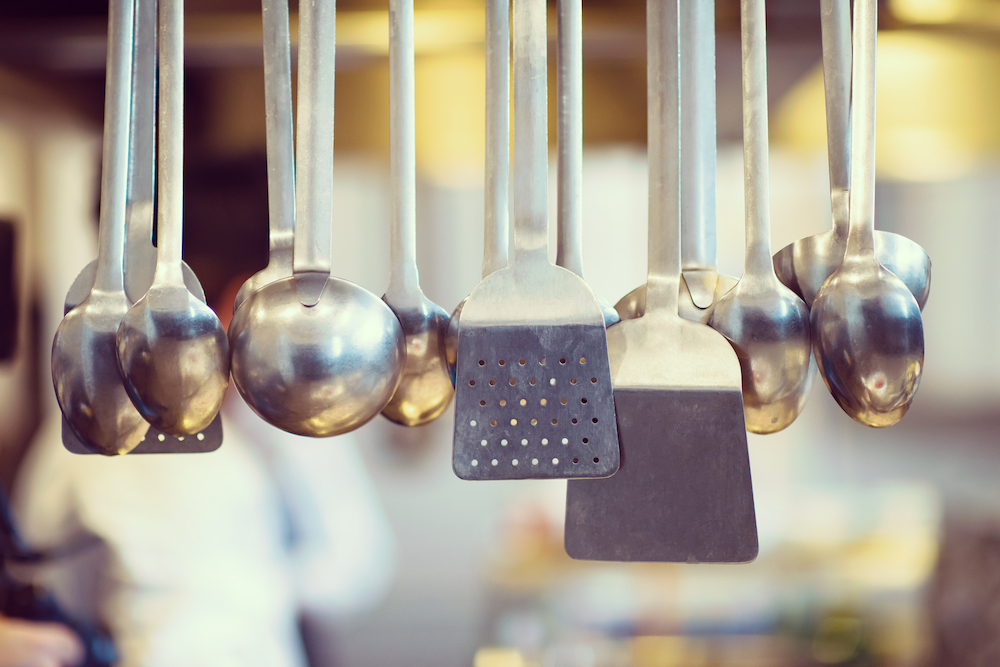 Kitchen utensils hanging in a modern kitchen