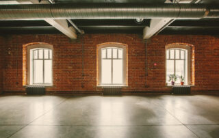 Three windows in an open loft apartment