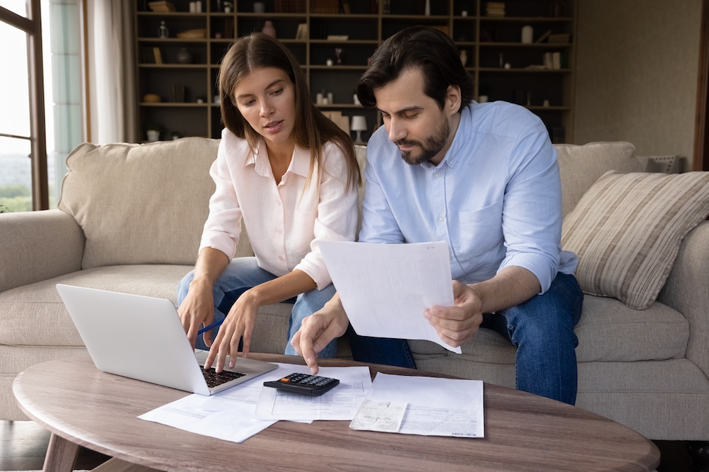 A young couple working to set a budget