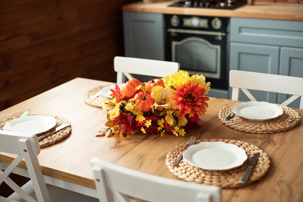 A dining room table set up for Thanksgiving