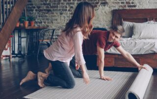 A young couple decorating one of the loft style apartments for rent