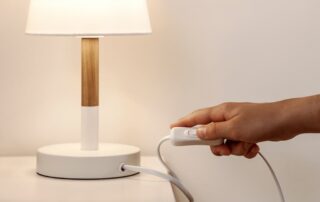 A woman turning on a lamp at the apartments in St. Joe, MO