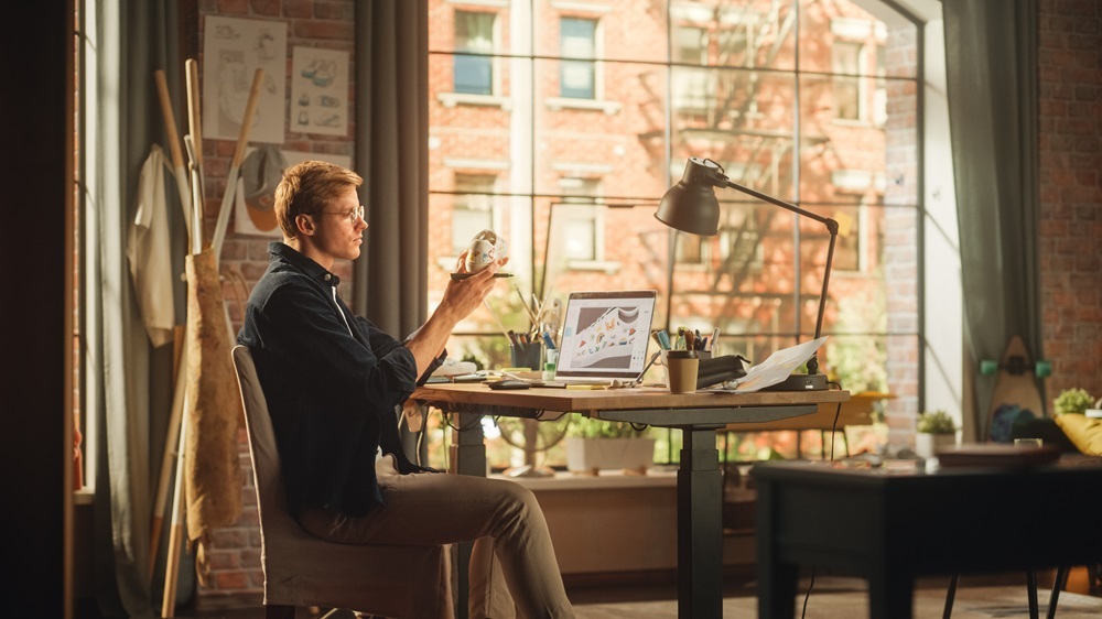 A man working from home at his kitchen table